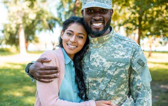 Army couple hugging